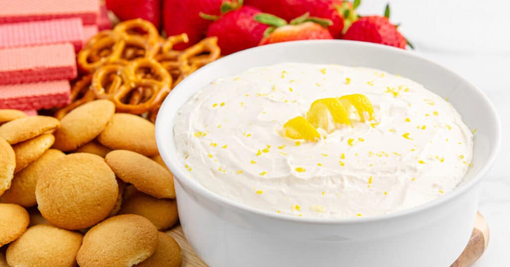 Lemon Cheesecake Dip in Bowl with Wafers and Strawberries