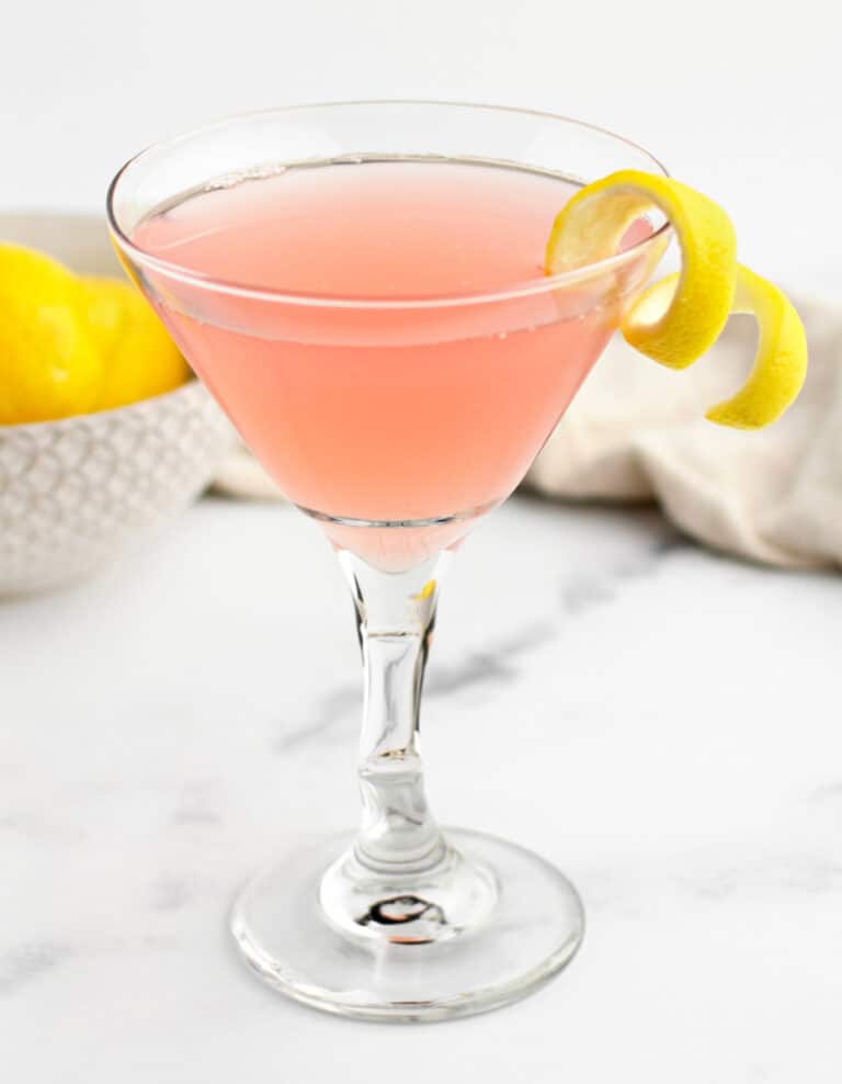 Lemon Twist on Martini Cocktail with Lemons in Bowl in Background