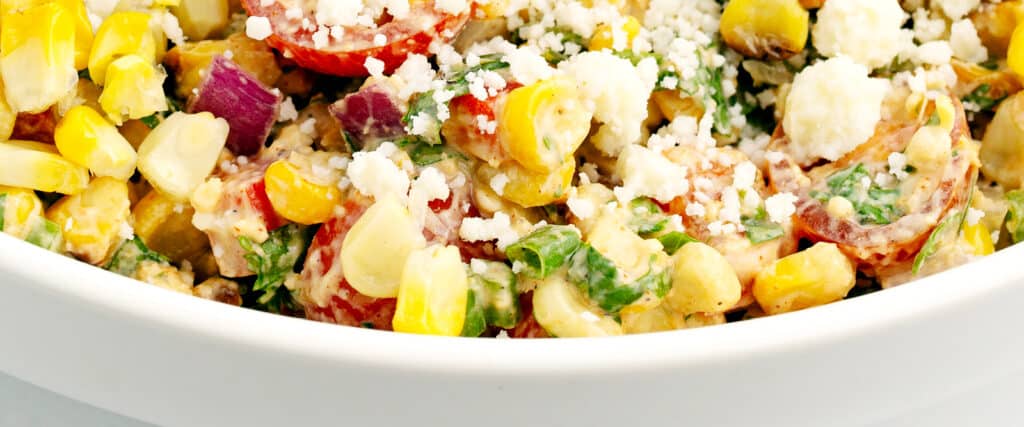 Closeup of Street Corn Salad in White Serving Bowl