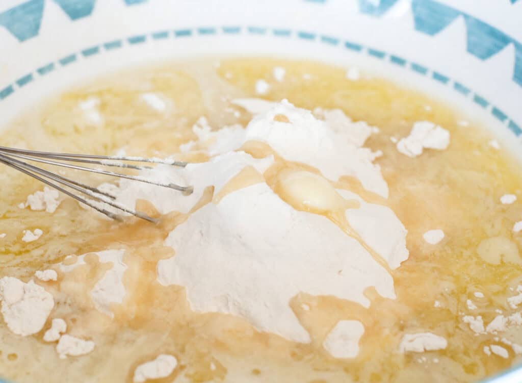 Adding Dry Ingredients to Mini Almond Cake Batter