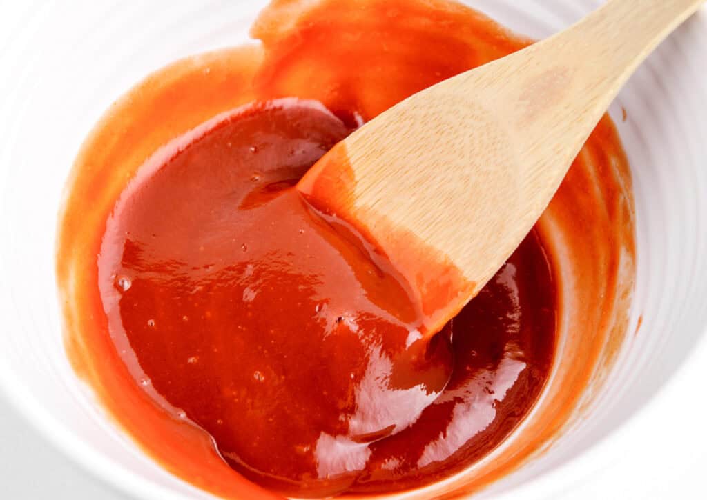 Fully Mixed Sauce in White Bowl With Spoon