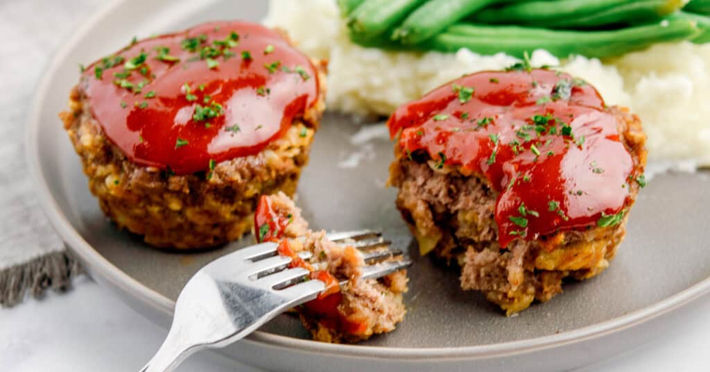 Mini Meatloaves on Grey Plate with Fork, Potatoes, and Green Beans