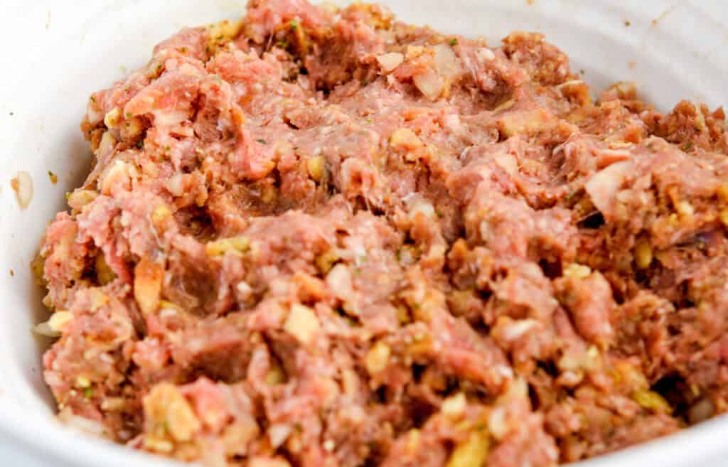 Final Meatloaf Mixture in White Bowl