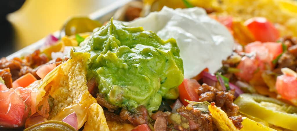 Sour Cream and Guac on Nachos