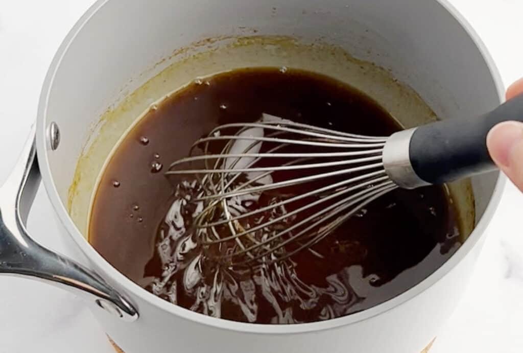 Whisk Pumpkin Spice Syrup in Saucepan
