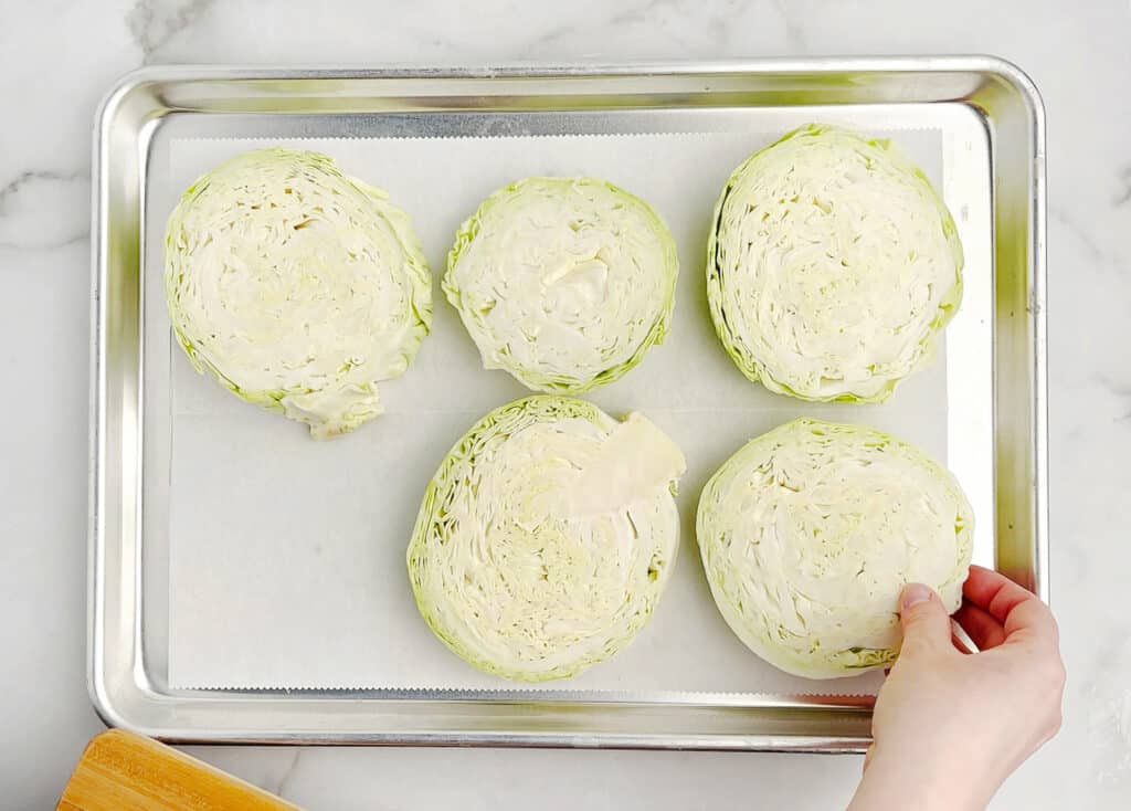 Raw Cabbage Slices on Pan with Parchment Paper