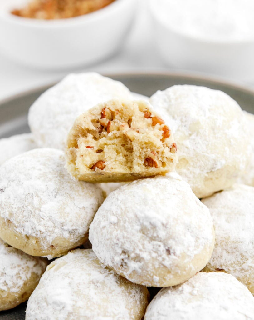 Snowball Cookies in Pile with One Cookie Split Open