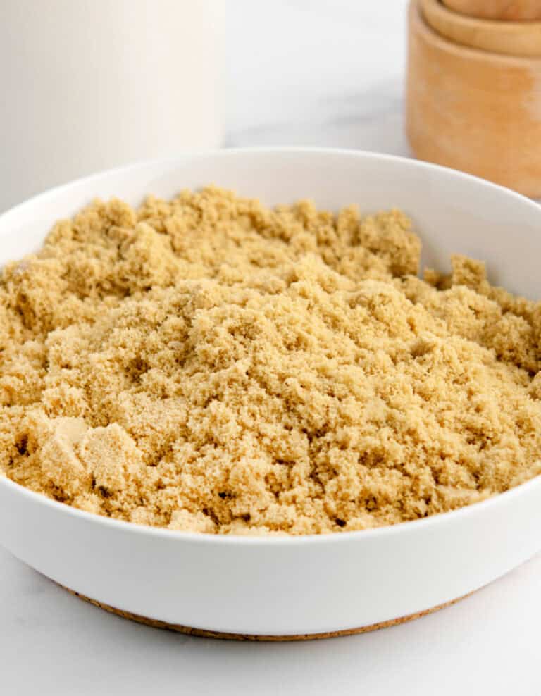 Brown Sugar in a White Bowl on White Marble Surface