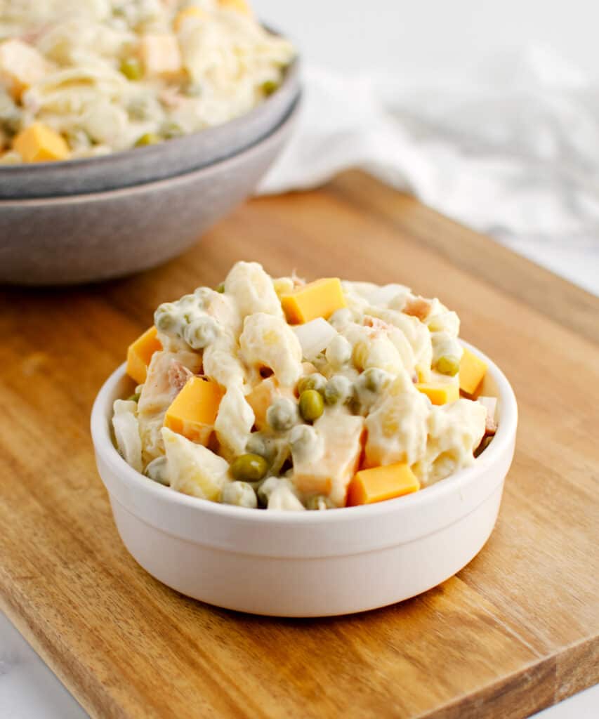 Pasta Salad in Serving Bowl with Peas, Cheese, Onions, and Tuna