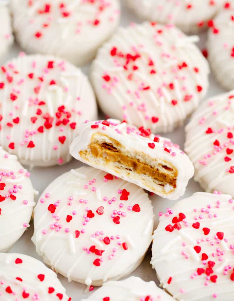 White Chocolate Cracker Valentine Cookies with One Cut Open Showing the Crackers and Peanut Butter Inside