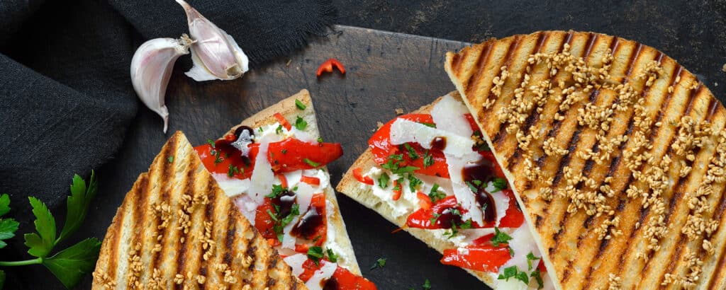 Panini with Cherry Peppers on Black Background