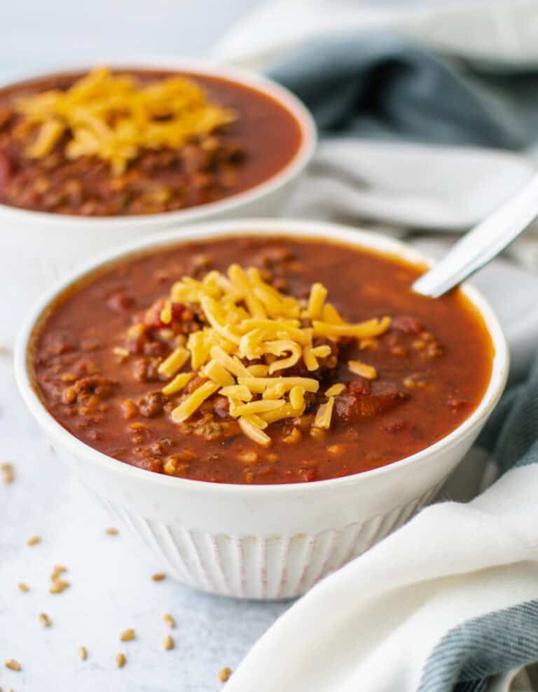 Wheat Berry Chili in Bowls with Spoon and Kitchen Towel
