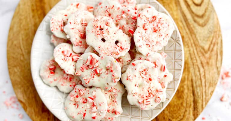 White Chocolate Peppermint Pretzel Crisps on Plate on Wooden Surface