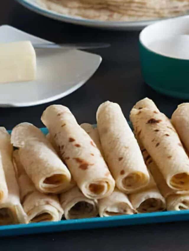 Closeup of Lefse Rolls on a Serving Platter with Butter and Sugar in the Background